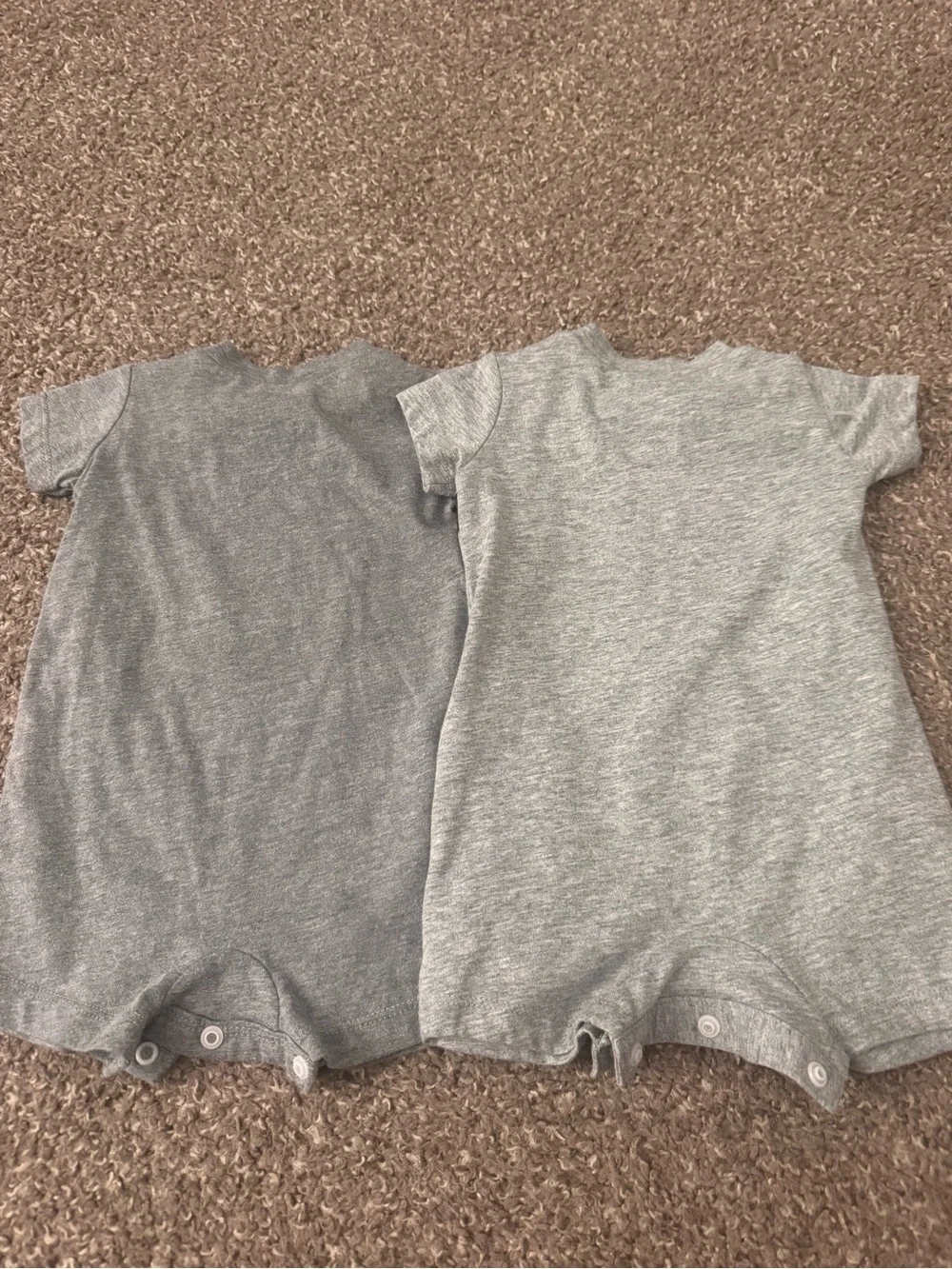 Two Nike Onesies